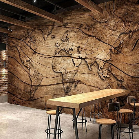 Papier peint carte du monde effet bois.
