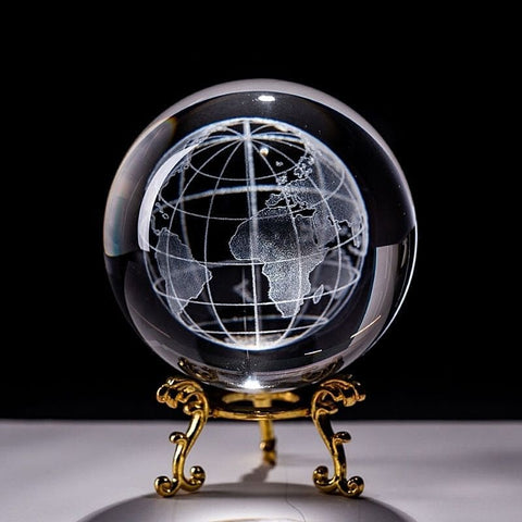 Globe décoratif en verre base or.