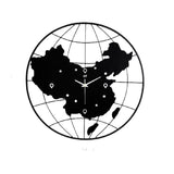 Horloge monde en métal continent